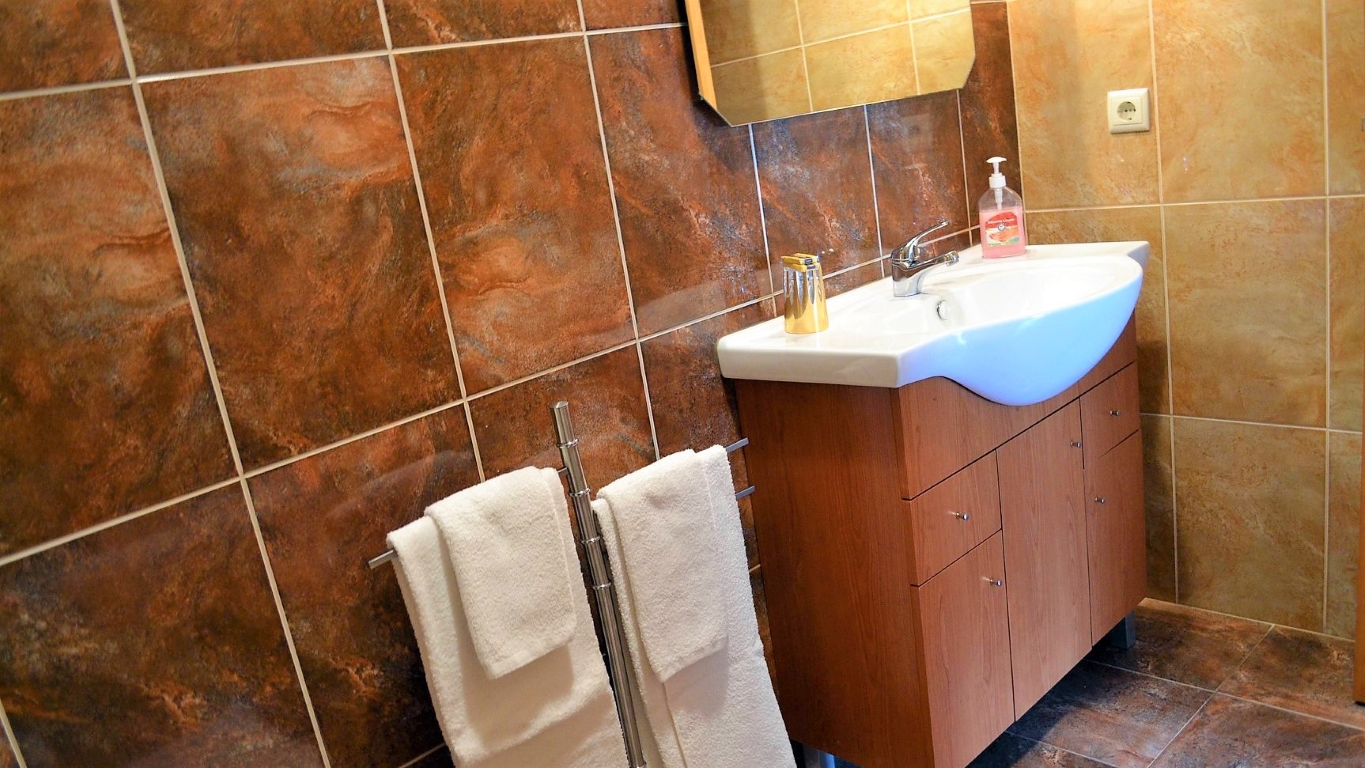 Bathroom with bathtub and shower